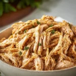 Slow-cooked shredded chicken breast in a crockpot, perfect for easy meals