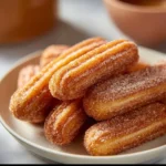 Delicious healthy baked churro bites sprinkled with cinnamon and sugar
