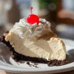 Delicious slice of Root Beer Float Pie with whipped cream topping
