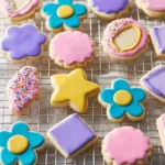 Delicious rolled sugar cookies decorated with icing and sprinkles