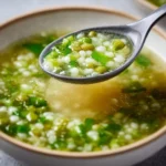 Delicious vegetarian soup with peas in a bowl, garnished and ready to serve
