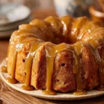 Delicious Apple Bundt Cake with apples and spices on a decorative plate