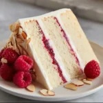 Delicious Raspberry Almond Cake with fresh raspberries and almond topping