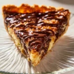 Samoas Cookie Pie topped with chocolate and coconut flakes