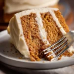 Delicious homemade spice cake with cream cheese frosting ready to serve