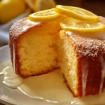 Delicious lemon cake with frosting, garnished with lemon slices