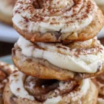Cinnamon Roll Cheesecake Cookies topped with cream cheese frosting