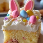 Easter Bunny Poke Cake topped with colorful treats for a festive spring dessert