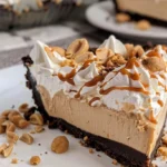 Delicious no bake peanut butter pie garnished with chocolate and peanuts