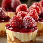 Raspberry Lemon Cheesecake Cups topped with fresh raspberries and lemon zest
