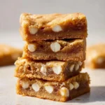 Delicious homemade blondies on a plate, showcasing their chewy texture and golden color