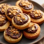 Delicious cookie cups with rich fudge filling on a decorative plate