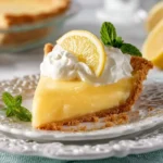 Delicious Lemon Almond Pie topped with almonds and lemon slices.