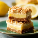 Homemade lemon oat bars topped with lemon zest and coconut flakes