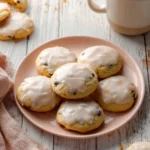 Plate of freshly baked Orange Ricotta Cookies with citrus zest