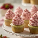 Pistachio Strawberry Cupcakes topped with fresh strawberries and nuts