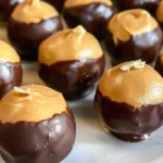 Delicious Buckeyes, chocolate-covered peanut butter balls, perfect for dessert.