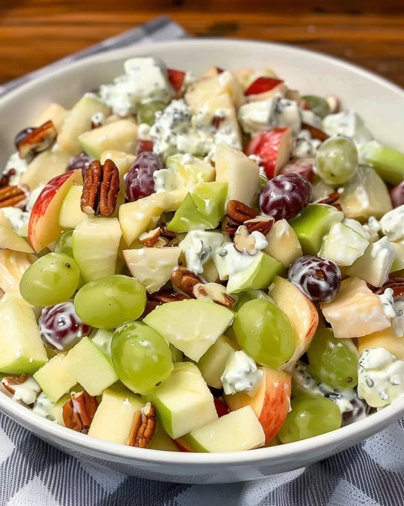 Colorful fruit salad drizzled with creamy sour cream dressing