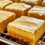 Delicious pumpkin sheet cake with brown butter icing on a rustic wooden table