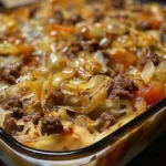 Savory Cabbage Beef Bake served in a baking dish, garnished with herbs